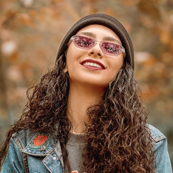 Avery Chen, Lead Design Curator at PlanetIsleAmple, reviewing corporate floral arrangements